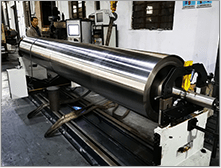 Vacuum steel roller is being processed on grinding machine